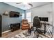 Office/bedroom featuring a TV, desk, chair, and area rug at 239 Bradford Glyn Dr, Mooresville, NC 28115