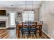 Cozy dining room featuring hardwood floors, a modern light fixture, and a wood table with comfortable seating at 239 Bradford Glyn Dr, Mooresville, NC 28115