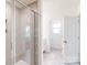 Contemporary bathroom includes a glass shower and natural light at 2792 Yeager Nw Dr, Concord, NC 28027