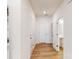Bright hallway with durable wood-look flooring connecting various rooms in the home at 2792 Yeager Nw Dr, Concord, NC 28027