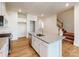 Contemporary kitchen with granite countertops, an island with a sink, and stainless steel appliances at 2792 Yeager Nw Dr, Concord, NC 28027
