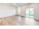 Bright living area with hardwood floors, a sliding glass door, and plenty of natural light at 2792 Yeager Nw Dr, Concord, NC 28027