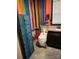 Colorful bathroom featuring vibrant wall stripes, a unique toilet, and dark vanity at 291 Love Valley Rd, Statesville, NC 28625