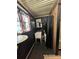 Rustic bathroom featuring a vessel sink, black shower curtain, and neutral rug at 291 Love Valley Rd, Statesville, NC 28625