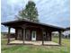 Cozy cabin with a covered porch and rocking chairs, nestled in a serene outdoor setting at 291 Love Valley Rd, Statesville, NC 28625