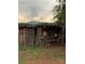 Rustic wooden outbuilding with vintage wash station against a scenic mountain backdrop at 291 Love Valley Rd, Statesville, NC 28625