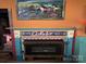 Eclectic fireplace with intricate tile work and vibrant colors, a focal point in the room at 291 Love Valley Rd, Statesville, NC 28625