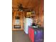 Cabin interior with wood paneled walls and ceiling fan, featuring a kitchenette at 291 Love Valley Rd, Statesville, NC 28625