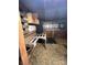 Inside a storage shed with wooden shelves and pallets, filled with hay at 291 Love Valley Rd, Statesville, NC 28625