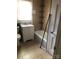 Bathroom featuring a tiled shower-tub and a white vanity with a mirror and chrome fixtures at 401 Plymouth St, Kannapolis, NC 28083