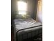 Bedroom with a window bringing in natural light and a comfortable-looking bed frame at 401 Plymouth St, Kannapolis, NC 28083