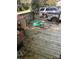 Rustic wooden deck needing some repair and maintenance with toys and playhouse at 401 Plymouth St, Kannapolis, NC 28083