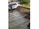 Wooden deck with railings requiring maintenance and showing a tricycle at 401 Plymouth St, Kannapolis, NC 28083