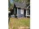 Charming single-story home with grey siding, white trim, and well-maintained lawn at 401 Plymouth St, Kannapolis, NC 28083