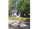 Charming single-story home with grey siding, white trim, and a well-maintained front yard at 401 Plymouth St, Kannapolis, NC 28083