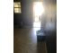 Hallway with durable tile flooring leading to a bright, light-filled room at 401 Plymouth St, Kannapolis, NC 28083