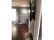 Living room with hardwood floors, neutral paint, and front door visible in the background at 401 Plymouth St, Kannapolis, NC 28083