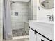 Modern bathroom featuring a tiled shower with a built-in bench at 403 Greenbriar S Rd, Statesville, NC 28625