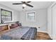 Simple bedroom with two windows and a warm, neutral color palette at 403 Greenbriar S Rd, Statesville, NC 28625