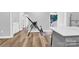 Bright room with wood floor and an inversion table next to an island at 403 Greenbriar S Rd, Statesville, NC 28625