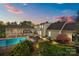 A private backyard oasis with a sparkling pool, covered patio, and ample space for outdoor entertaining at 405 Downing Dr, Kings Mountain, NC 28086