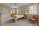 Cozy bedroom features a comfortable bed, neutral walls, carpet flooring, and natural light through the windows at 405 Downing Dr, Kings Mountain, NC 28086
