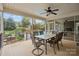 The screened-in porch has a dining area with a view of the pool and private backyard at 405 Downing Dr, Kings Mountain, NC 28086