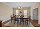 Dining room with hardwood floors, chandelier, and large table, perfect for Gathering meals at 405 Downing Dr, Kings Mountain, NC 28086