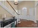 Inviting foyer with hardwood floors, staircase, and elegant lighting, showcasing the home's charm at 405 Downing Dr, Kings Mountain, NC 28086