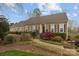 Charming single-story home features neat landscaping, a brick walkway, and a welcoming front entrance at 405 Downing Dr, Kings Mountain, NC 28086