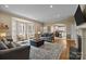Spacious living room with an open floor plan, fireplace, and large windows at 405 Downing Dr, Kings Mountain, NC 28086