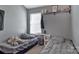 Cozy bedroom with two beds, a window for natural light, and a shelf for storage and decor at 4517 Sabin St, Rock Hill, SC 29732