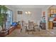 Cozy dining room featuring elegant floral chairs, a chandelier, and natural light at 4517 Sabin St, Rock Hill, SC 29732