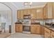 Functional kitchen featuring wood cabinets, granite countertops, and stainless steel appliances at 4517 Sabin St, Rock Hill, SC 29732