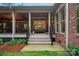 Covered back porch with brick columns and wood ceiling offers a relaxing outdoor space at 4637 Gold Finch Dr, Denver, NC 28037