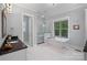 Serene bathroom features a soaking tub, walk-in shower, granite counters, and natural light at 4637 Gold Finch Dr, Denver, NC 28037