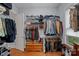 Walk-in closet features ample storage space with built-in shelving and hanging racks for organized wardrobe display at 4637 Gold Finch Dr, Denver, NC 28037