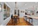 Kitchen flows to an eat-in dining space, complete with seating and bright natural light at 4637 Gold Finch Dr, Denver, NC 28037