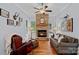 Cozy living room features a stunning stone fireplace, hardwood floors, and comfortable seating at 4637 Gold Finch Dr, Denver, NC 28037