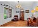 Cozy living room featuring hardwood floors, a leather chair, and natural light at 4637 Gold Finch Dr, Denver, NC 28037