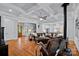 Spacious living room featuring a fireplace, hardwood floors, and a coffered ceiling at 4637 Gold Finch Dr, Denver, NC 28037