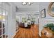 Open-concept living room showcasing hardwood floors, coffered ceilings, and lots of seating at 4637 Gold Finch Dr, Denver, NC 28037