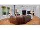 Comfortable living area with hardwood floors, corner fireplace, and ample seating at 4637 Gold Finch Dr, Denver, NC 28037