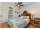 Bedroom with hardwood floors, neutral walls, a large window, and a high, vaulted ceiling at 481 Patriot Ne Ct, Concord, NC 28025