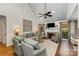 Cozy living room with a fireplace, hardwood floors, and stylish decor perfect for relaxation at 481 Patriot Ne Ct, Concord, NC 28025