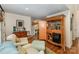 Comfortable living space featuring hardwood floors and a built-in bar area for entertaining guests at 481 Patriot Ne Ct, Concord, NC 28025