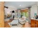 Inviting living room with hardwood floors, a fireplace, and large windows for natural light at 481 Patriot Ne Ct, Concord, NC 28025