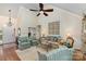Bright living room with high ceilings, hardwood floors, and elegant decor, a perfect place to relax at 481 Patriot Ne Ct, Concord, NC 28025
