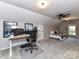 Spacious carpeted attic with bedroom and office area with natural lighting at 5043 Hickory Lake Ln, Matthews, NC 28105