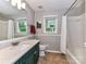 Bathroom with shower/tub combo and vanity with a quartz countertop at 5043 Hickory Lake Ln, Matthews, NC 28105